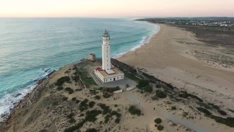 Reveal-Drone-shot-of-Trafalgar-Lighthouse-on-the-Costa-de-la-Luz-in-Caños-de-Meca,-Cadiz-Andalucia,-Spain