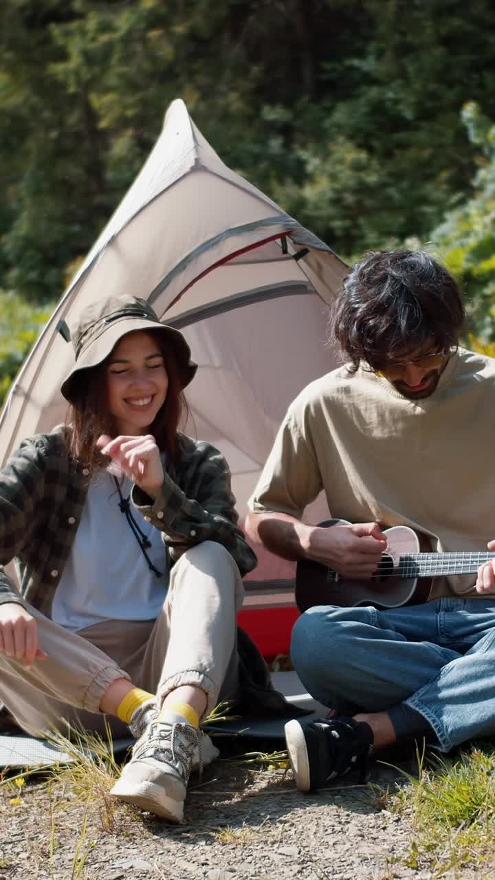 Couple Camping and Playing Ukulele