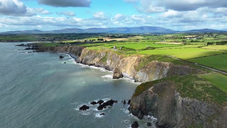 ireland epic locations drone landscape sun shine creeping along the coast copper coast waterford ireland