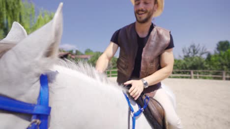 the man who rides the horse loves the horse. detail shooting.