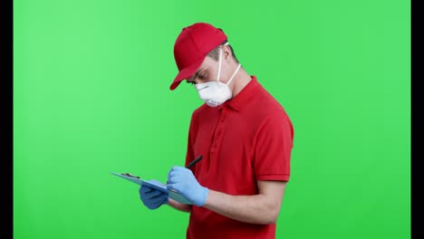 delivery person taking notes on clipboard