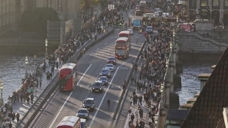 london bridge with crowded pedestrians and traffic