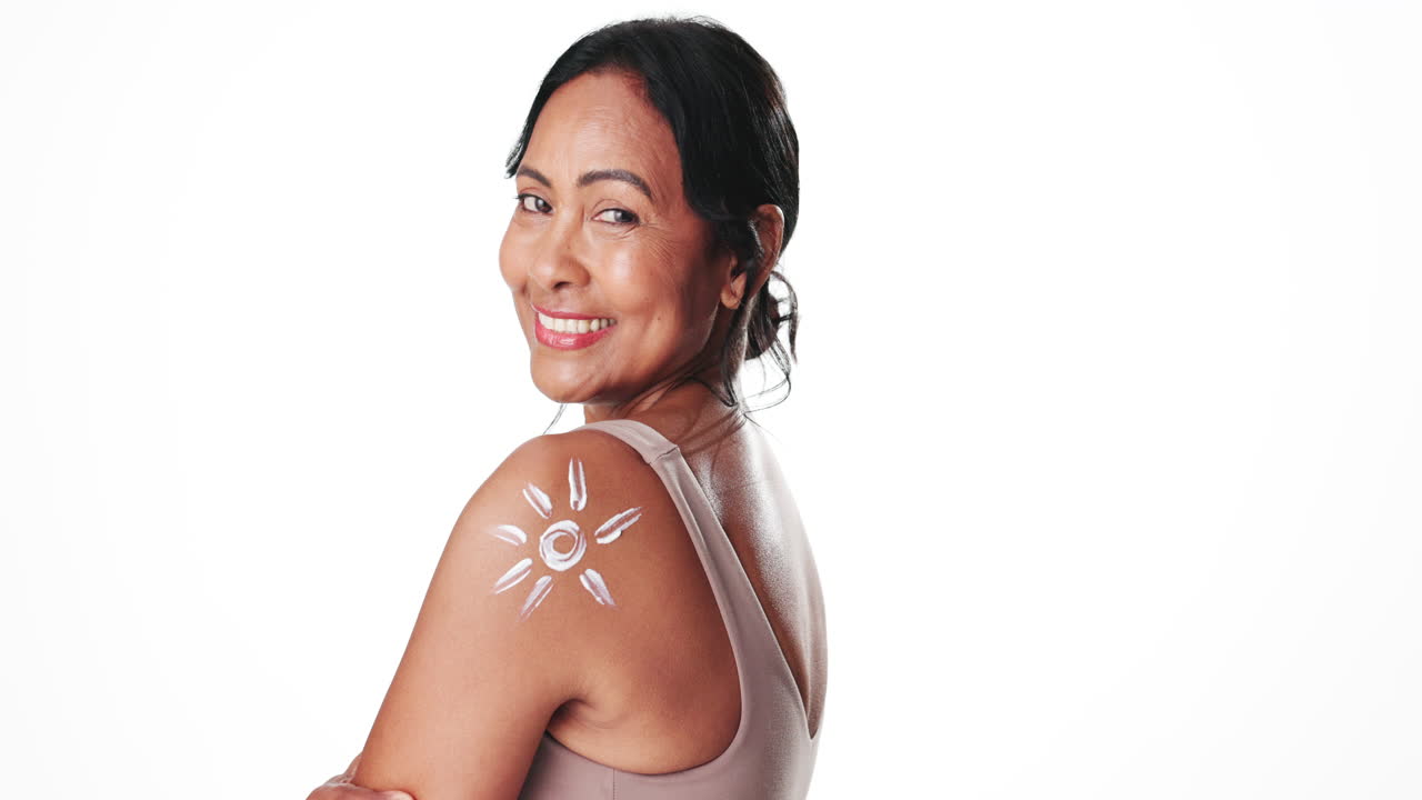 Happy Woman with Sunscreen Sun on Shoulder Smiling at Camera