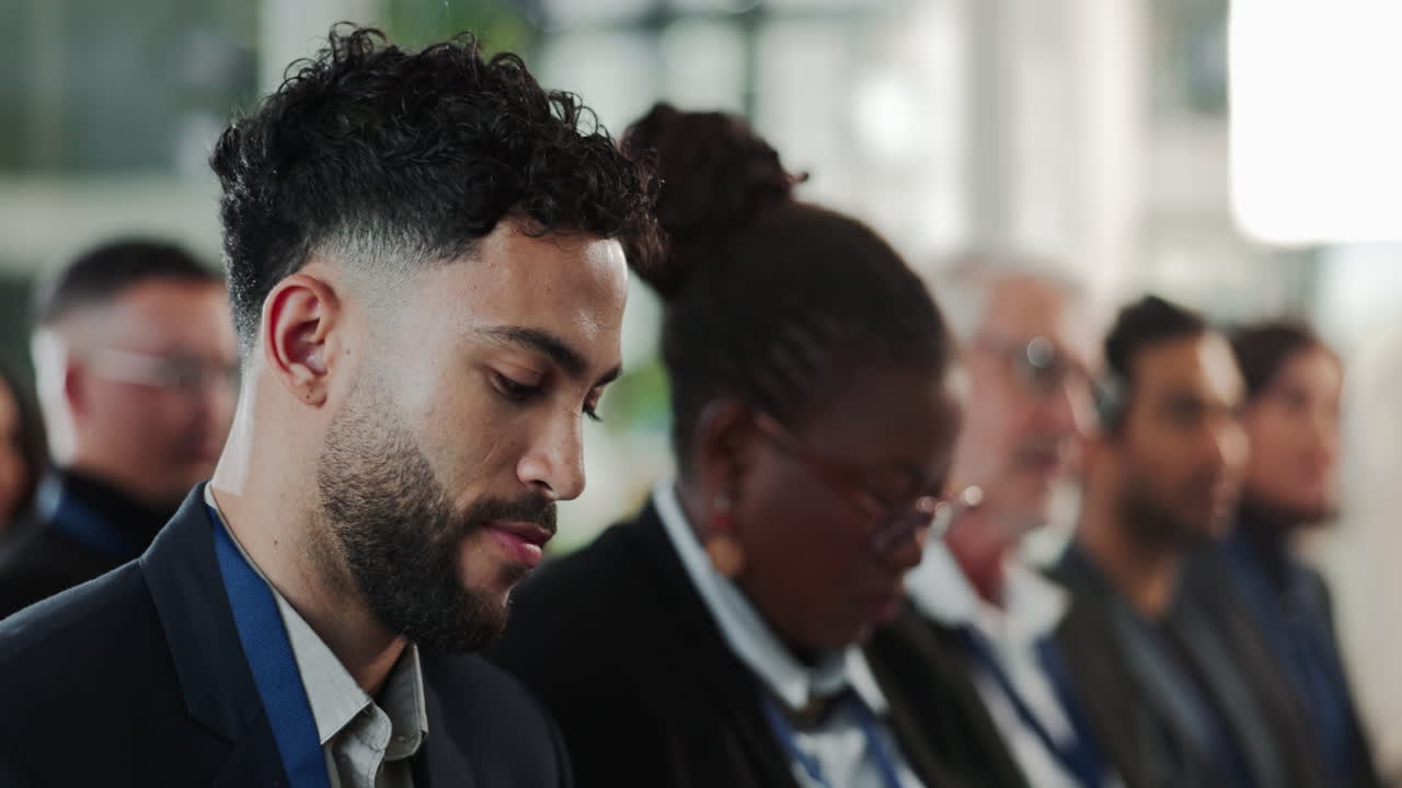 Business Meeting Attendees Listening to Presentation