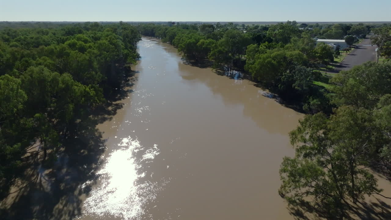 Aerial: Drone flying over an overflowing Darling River in Bourke, NSW Australia
