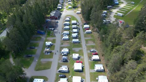 aerial overview of luxury campers in between pine tree forest of isaberg resort, sweden