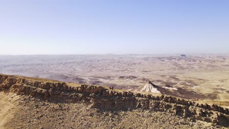 a zoom out shot of mountain landscape, desert