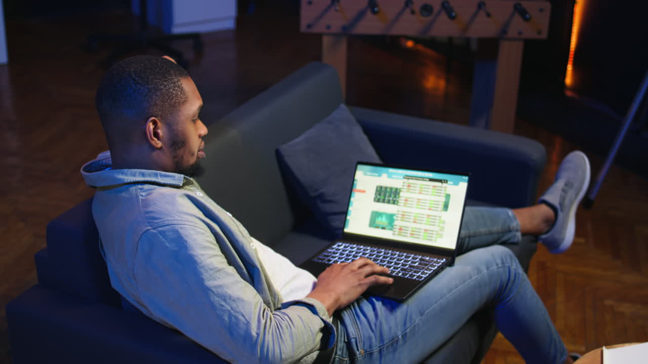 African american expert closing the monthly revenue balance on web platform