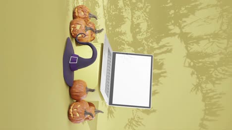 campaña publicitaria de halloween con una computadora portátil de pantalla en blanco, vertical