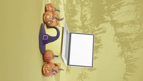 halloween advertising campaign with blank screen laptop, vertical