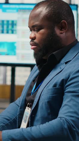 vertical video african american technician studies ai financial forecast development