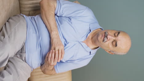 Vertical-video-of-Thoughtful-old-man-with-a-ring-in-his-hand.-Separation-thought.