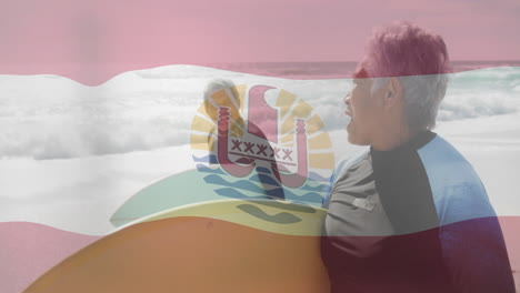 Holding surfboard on beach, man with French Polynesia flag animation overlay