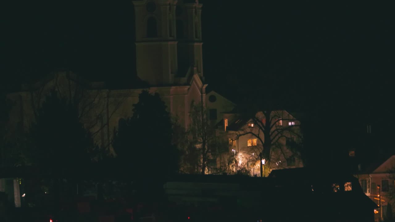Church and a graveyard at night
