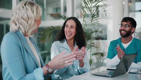 diverse team celebrating success and applauding during a meeting.
