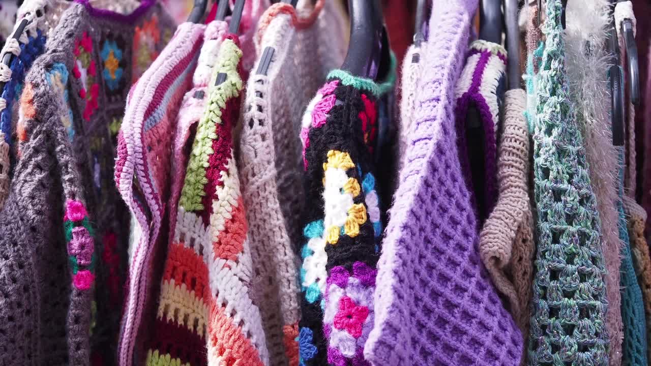 Colorful Knitwear on a Clothing Rack