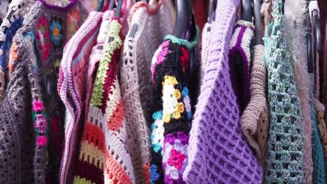 colorful knitwear on a clothing rack