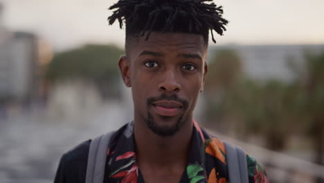 close-up-portrait-confident-african-american-man-tourist-looking-up-independent-black-male-funky-urban-style-in-city-sunset-background