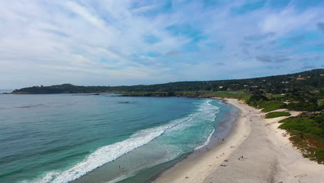 Aerial-view-of-calm-waves-at-the-Carmel-by-the-sea-in-sunny-Monterey,-CA,-USA