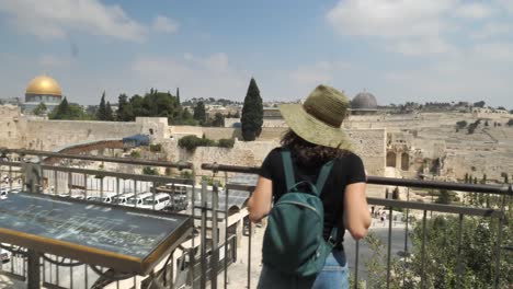 Unrecognizable-female-tourist-looking-at-Western-Wall,-Jerusalem,-Israel