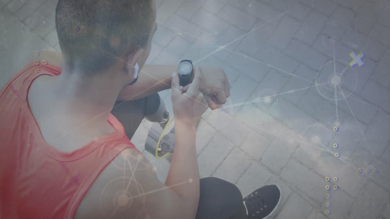 animación de puntos conectados, nubes contra vista de ángulo alto de hombre biracial usando reloj inteligente.