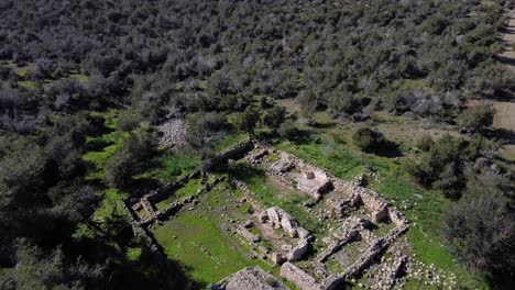 wide aerial drone shot flying over the ancient ruins of pyrgos tis rigenas, rigena tower byzantine monastery in akamas, cyprus