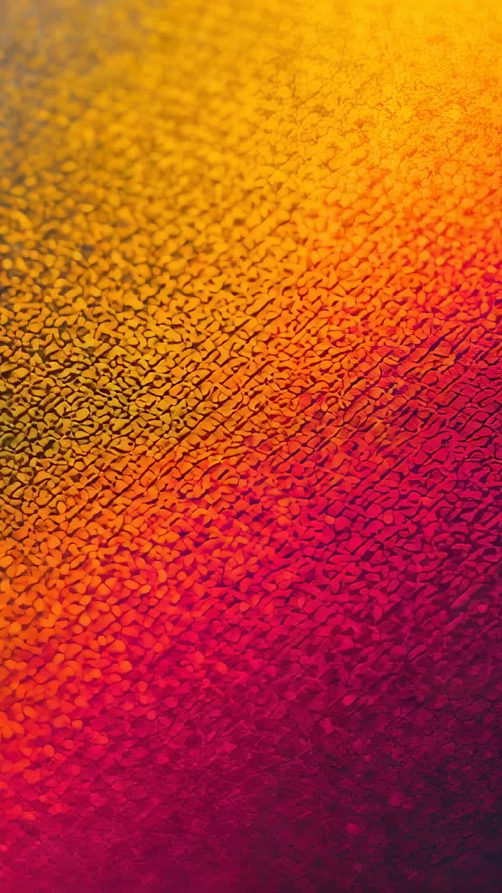Vertical video: Showing pebble fabric shifting yellow to red diagonal blend in macro, for study