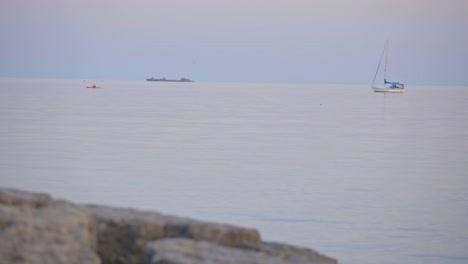 motorboat sailing on the calm water of the lake under the cloudy white sky