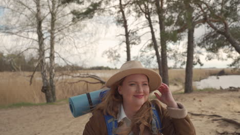 An-Attractive-Curvy-Red-Haired-Female-Walking-Happy-Through-The-Trees-Of-A-Forest