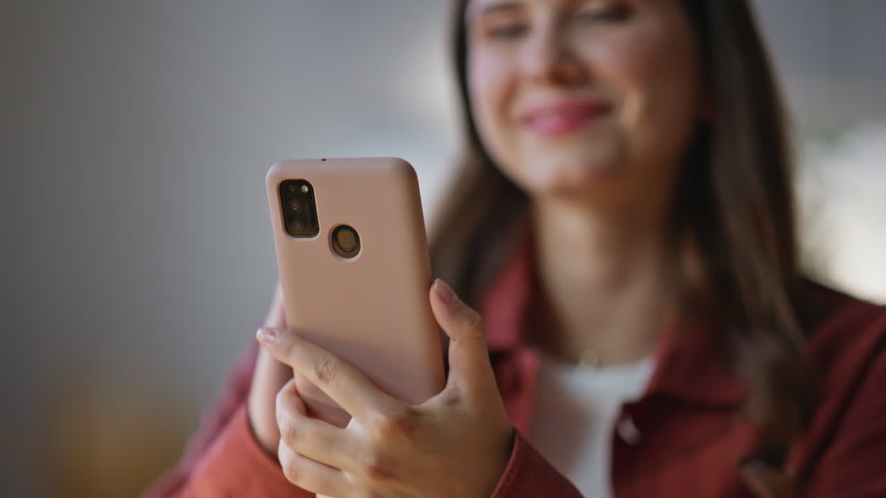 Happy girl browsing internet looking smartphone office closeup. Woman chatting
