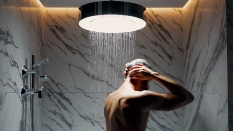 a man taking a shower in a modern bathroom