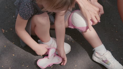 child preparing for roller-skating