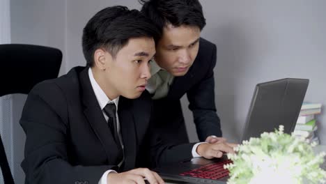 happy two business man using laptop computer to  successful working project