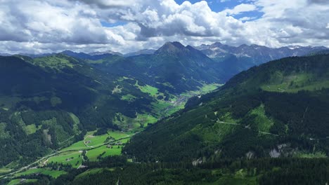 stunning views of white fluffy clouds over a beautiful green meadow, aerial