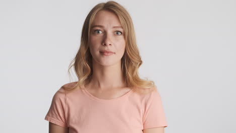 Caucasian woman nodding on camera.