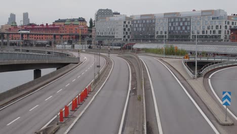 tripod shot of empty downtown highway with stockholm city in the background