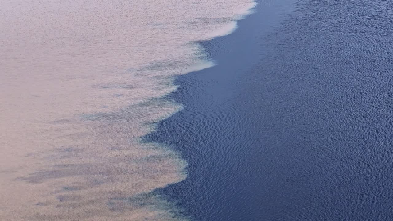 Light Sand Meets Deep Blue Water, Creating a Striking Natural Contrast - Aerial Drone Shot