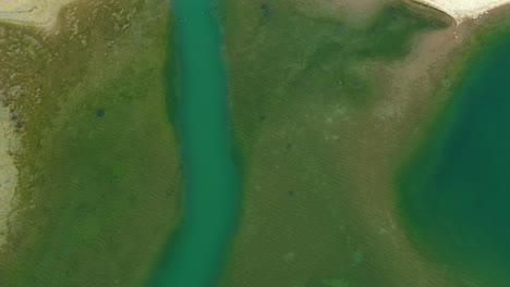 Birds-Eye-Aerial-View-of-Rifle-Dam-Gap,-Green-Water-and-Landscape,-Colorado-USA