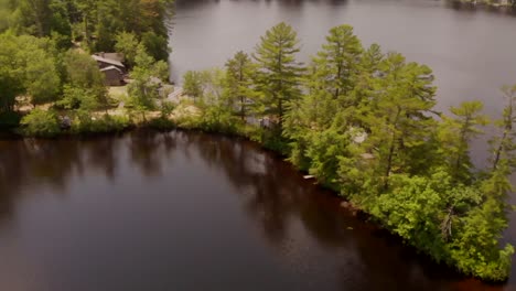 Climbing-rotating-shot-of-the-shore-on-a-small-pond