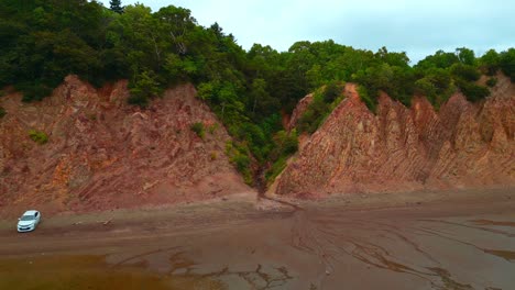 coastal cliffs and beach with people