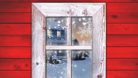 marco de ventana de madera contra el texto de felices vacaciones y la nieve cayendo sobre el paisaje de invierno