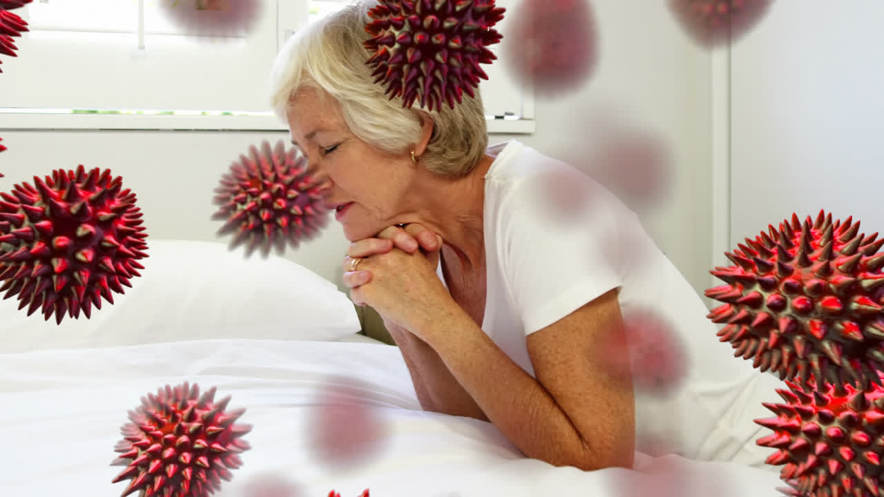 las células de covid-19 se mueven contra la mujer anciana que reza.