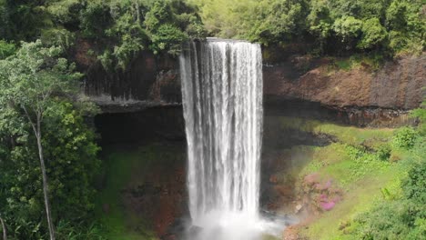 laos tad tayicsua waterfall aerial drone slow motion view, of popular touristic destination near bolaven plateau