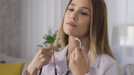 a doctor uses a stethoscope.