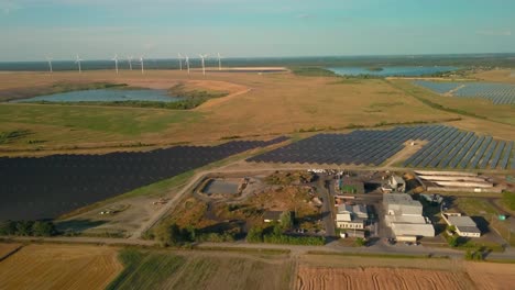 photovoltaic-solar-panel-with-wind-turbine-aerial-view-of-eco-friendly-electric-energy-production-base-station