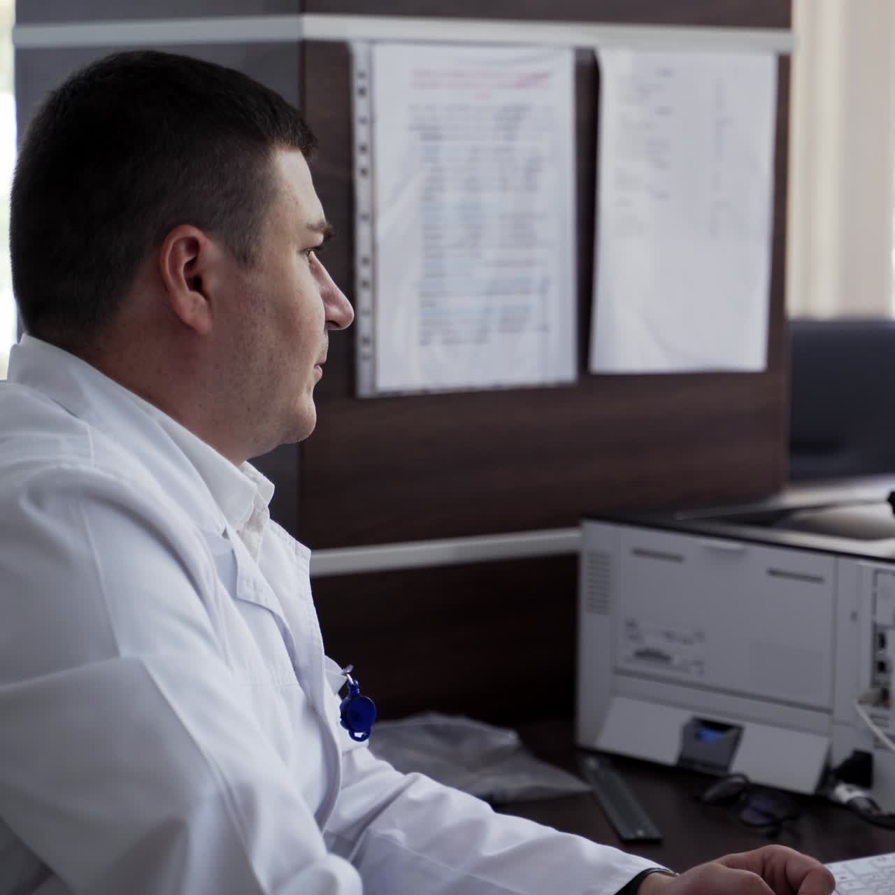 Doctor looking at computer monitor