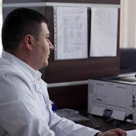 doctor looking at computer monitor