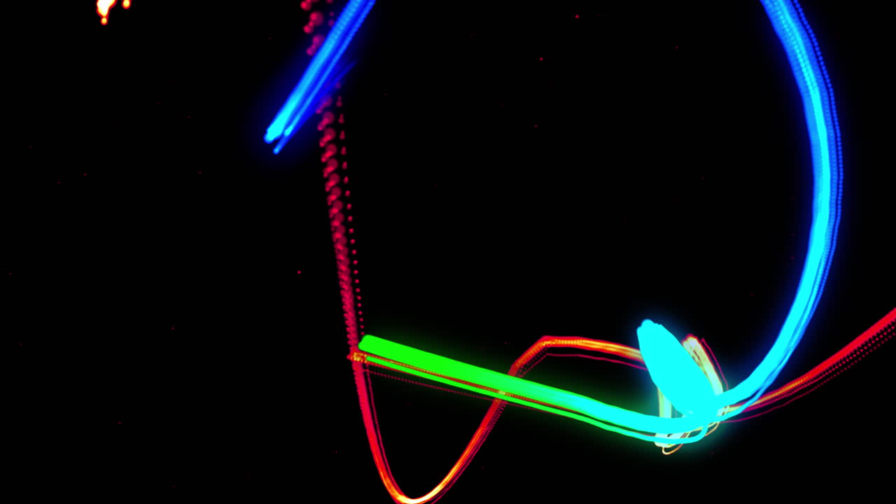 Animation of blue, green, orange and red light trails moving on black background