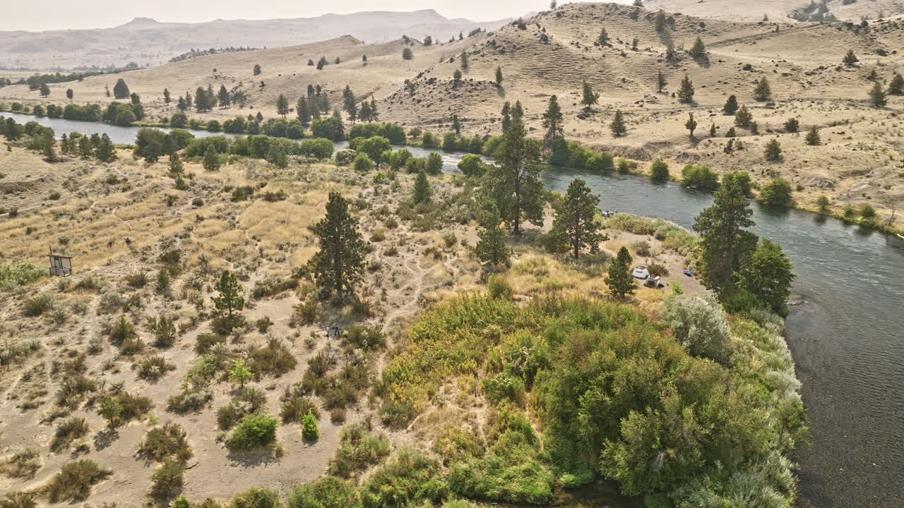 Deschutes River Oregon Aerial v72 cinematic drone fly above winding Deschutes river capturing riverside campgrounds near Oak Creek on a sunny day - Shot with Mavic 3 Cine - August 2022