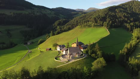 Santa Maddalena church in summer, aerial slow circle shot